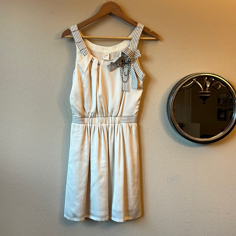 Cream dress with fun detail
